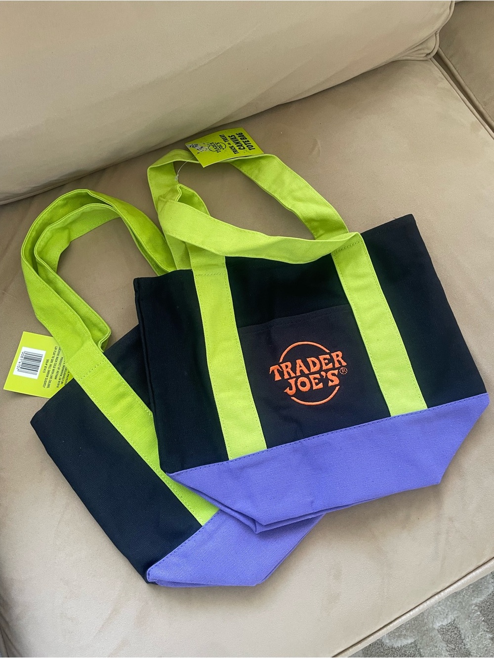 One Trader Joe’s Black Tote Bag with Lime Handles and Purple Base